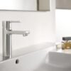 Shop the Roca Naia medium-height basin mixer in chrome: a minimalist geometric design with an energy-saving cold start and click-clack waste included.