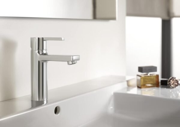Shop the Roca Naia medium-height basin mixer in chrome: a minimalist geometric design with an energy-saving cold start and click-clack waste included.